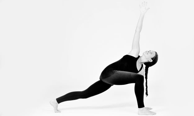 A woman completing a yoga pose