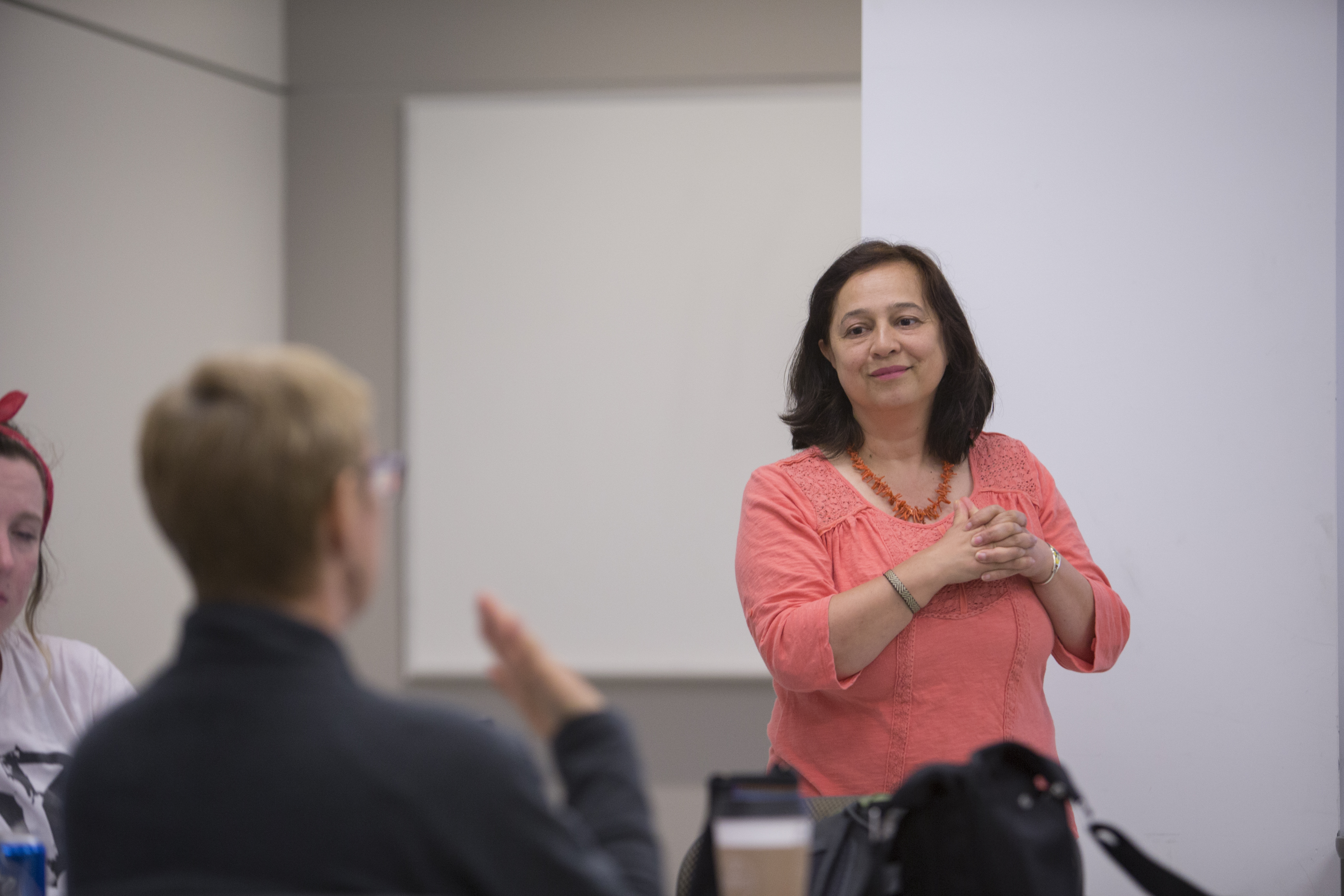 women speaking in a classroom